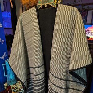 Warm & elegant reversible Black & striped cape. Knit fabric